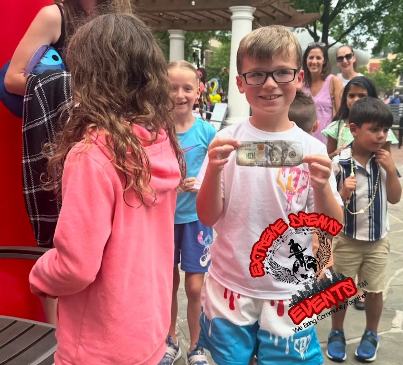 Children smiling together at an Xtreme Dreams community event